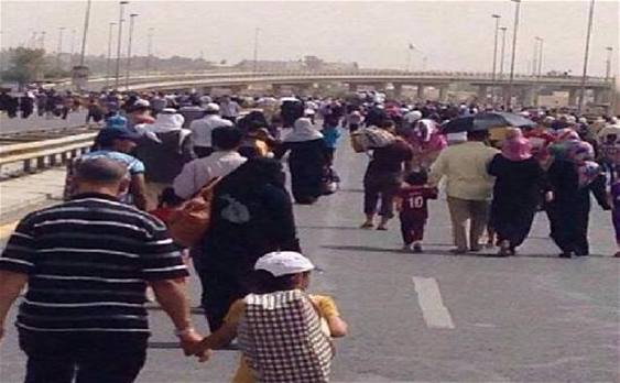 بالصور.. أهالي الموصل يفرون من مناطقهم