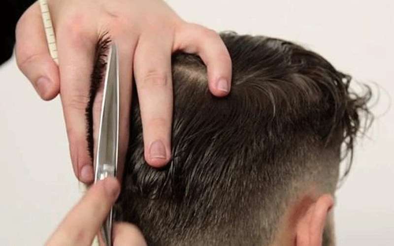 إيقاف 25 صالون حلاقة بالزرقاء