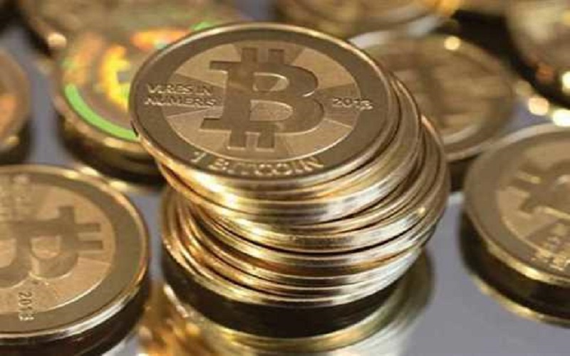 بيتكوين تقترب من 50 ألف دولار