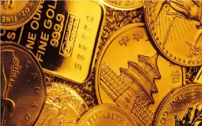 الذهب ينخفض بفعل قوة الدولار قبيل