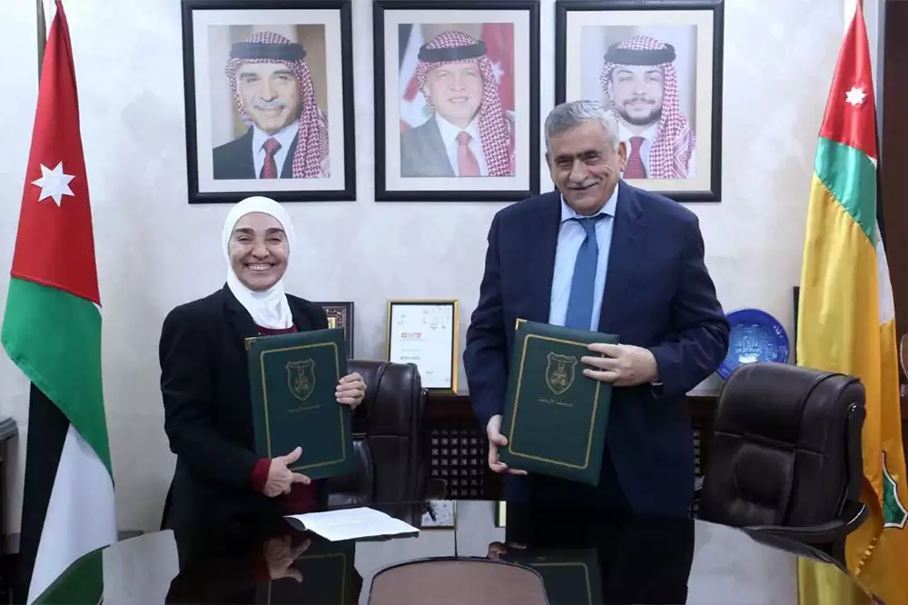 اتفاقية تعاون بين الجامعة الأردنية والوطني