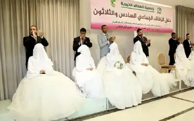 جمعية العفاف الخيرية تزف 18 عريسا