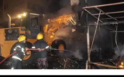 أضرار حريق سوق البالة في إربد