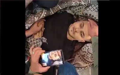 والدة الشهيد أحمد السعافين الموجودة في