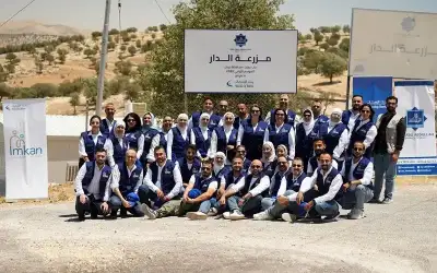 فريق إمكان الإسكان يشارك في جني