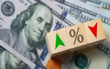 رويترز: خفض أسعار الفائدة مرة أو