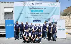 متطوعو إمكان الإسكان يشاركون في اليوم
