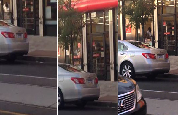 لص يحطم زجاج نافذة متجر برأسه