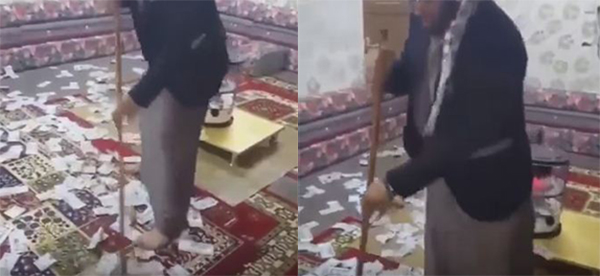 فيديو: شاب سعودي يتباهى بكنس أموال