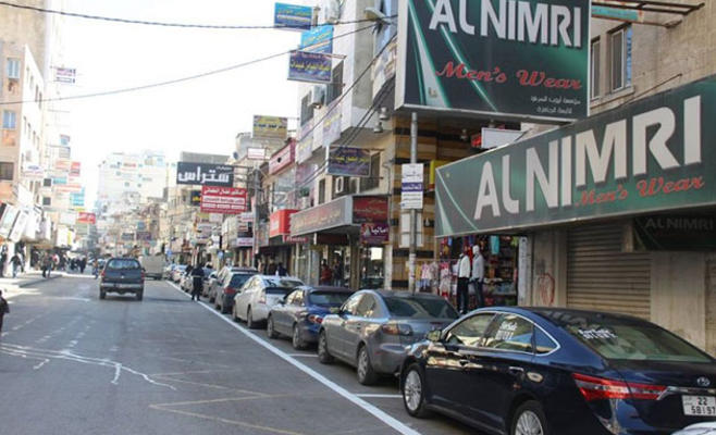 إربد: تحديد وقوف المركبات طوليا بشارع
