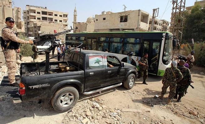 إجلاء 620 مقاتلا مع عائلاتهم من