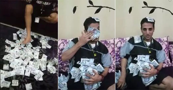 شاب يدوس نقودا بقدميه ومغردون يطالبون